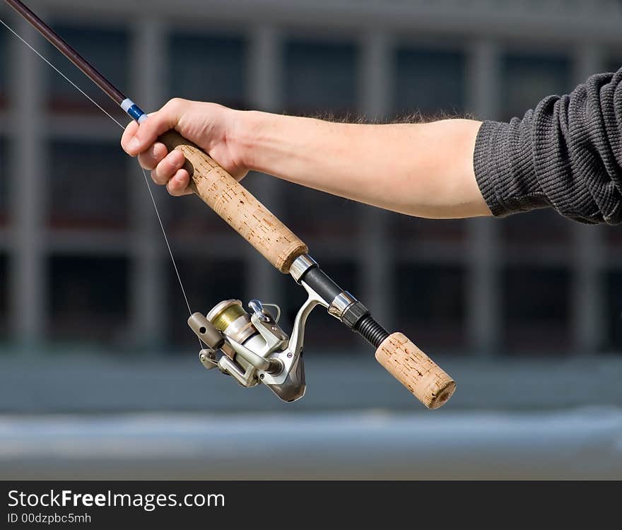 The light touch of a fisherman's hand feeling for a bite