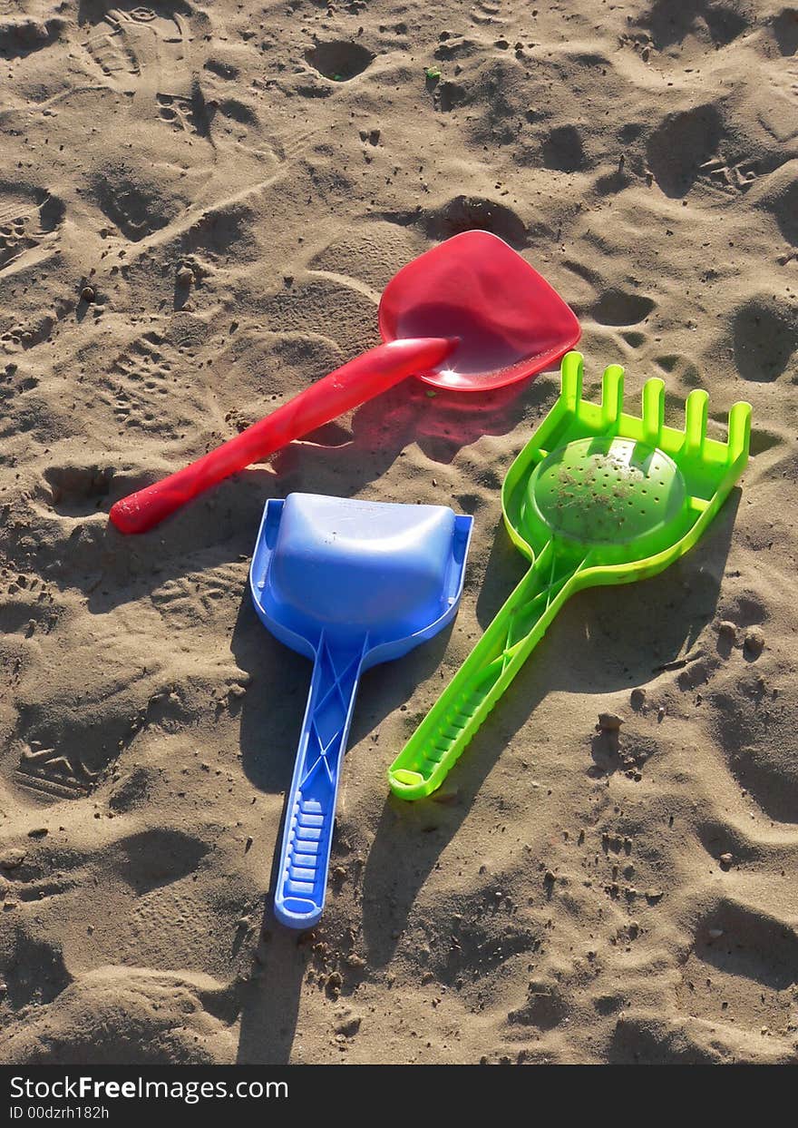 Close up of three colored pail on the sand. Close up of three colored pail on the sand