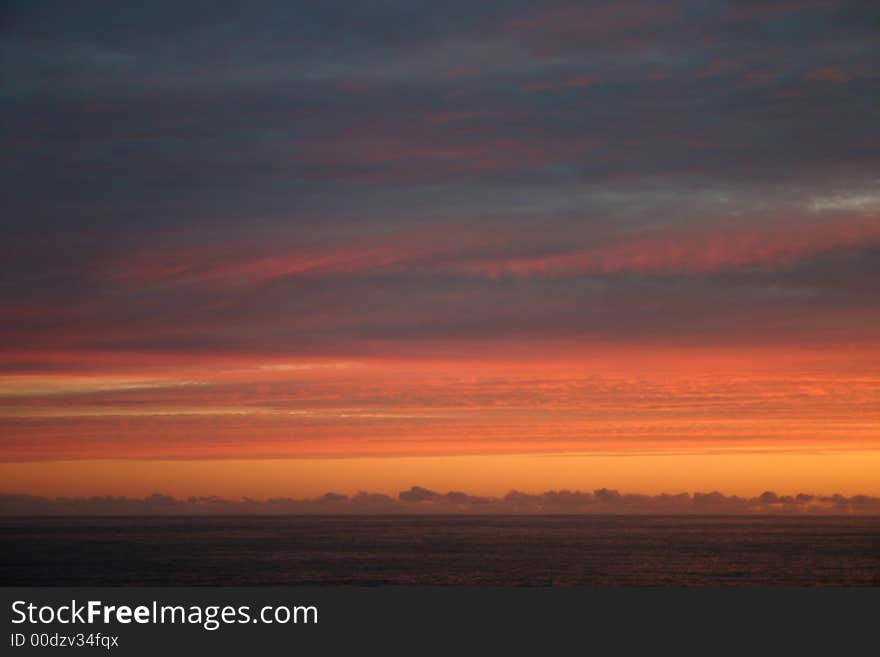 Sun setting over ocean in south africa. Sun setting over ocean in south africa