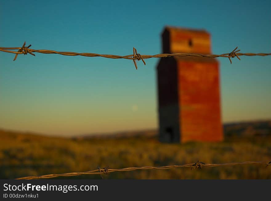 Long abandoned grain elevator in the badlands of the great plains.