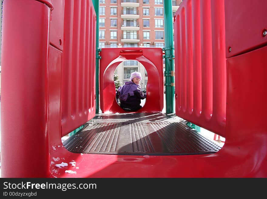 Little girl playing on the playground