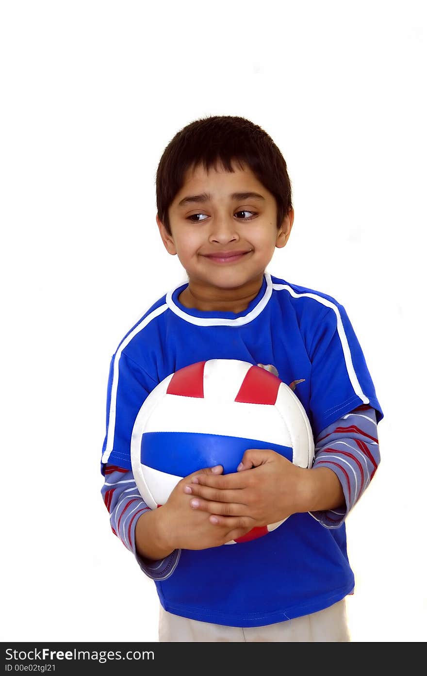 A young handsome kid holding a volleyball. A young handsome kid holding a volleyball