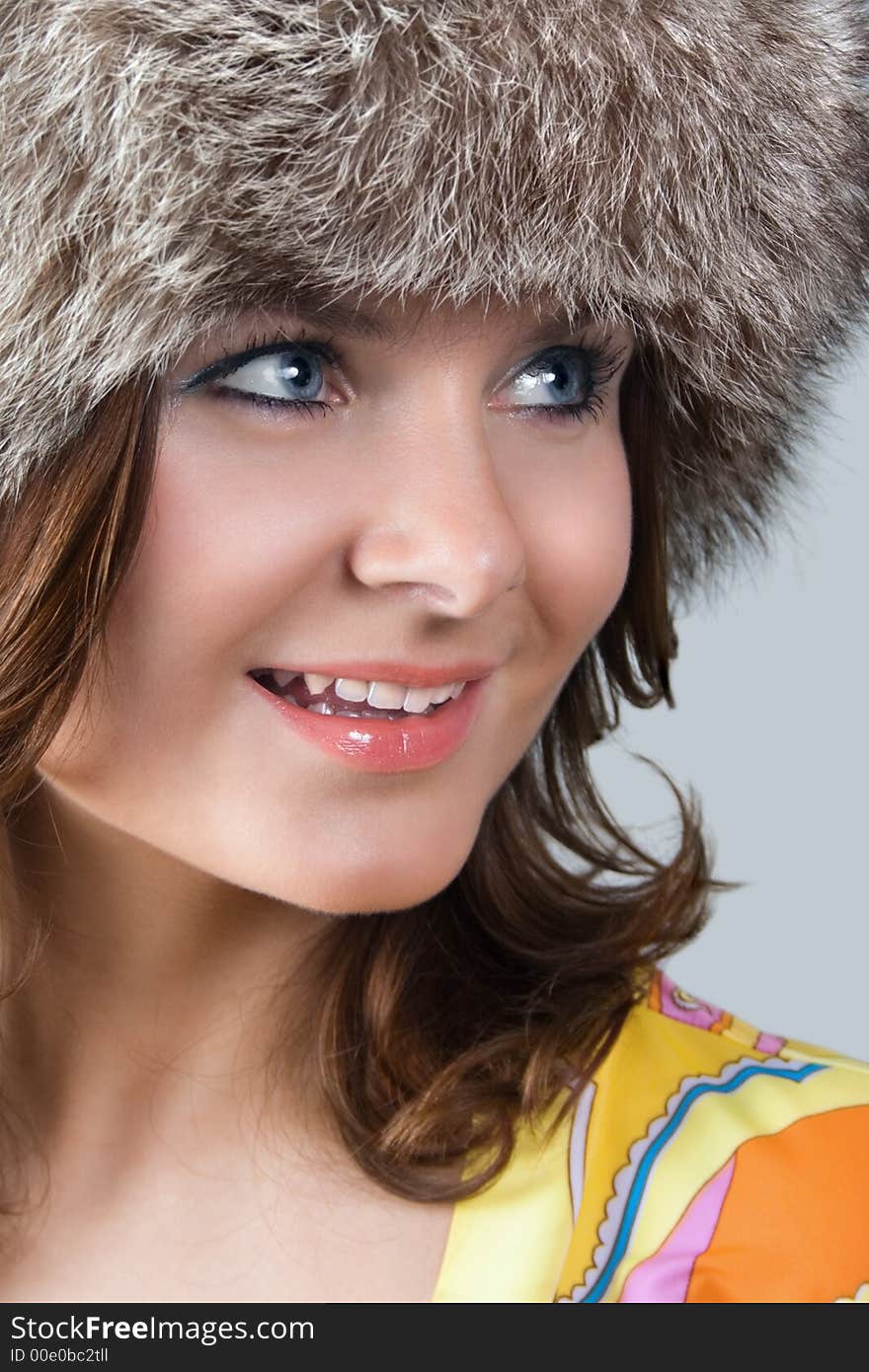 Portrait of a white beautiful woman in a fur hat. Portrait of a white beautiful woman in a fur hat