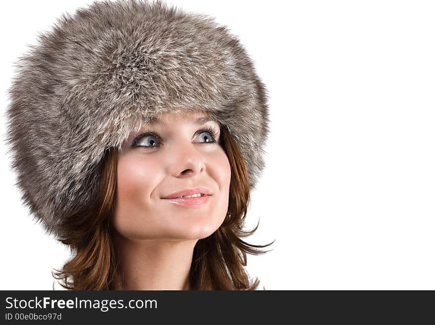 Portrait of a white beautiful woman in a fur hat. Portrait of a white beautiful woman in a fur hat