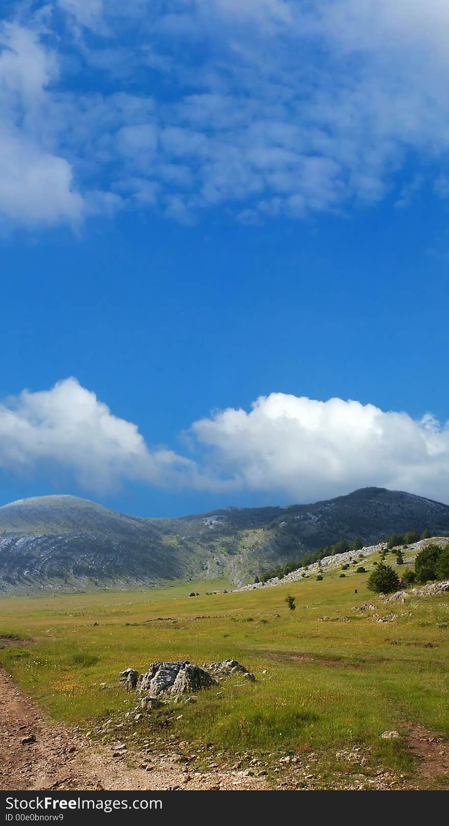 Dinara mountain over blue sky. South Croatia