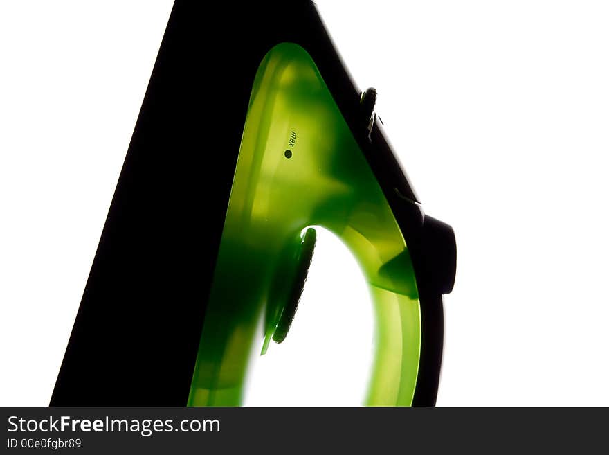 Green flat iron on white background