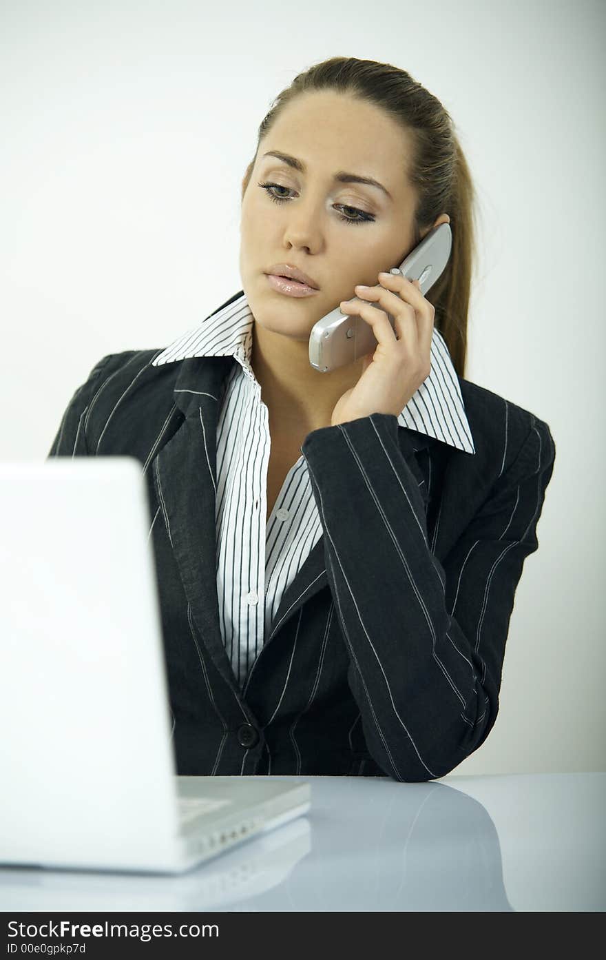 Beautiful business woman during daily office routines. Beautiful business woman during daily office routines