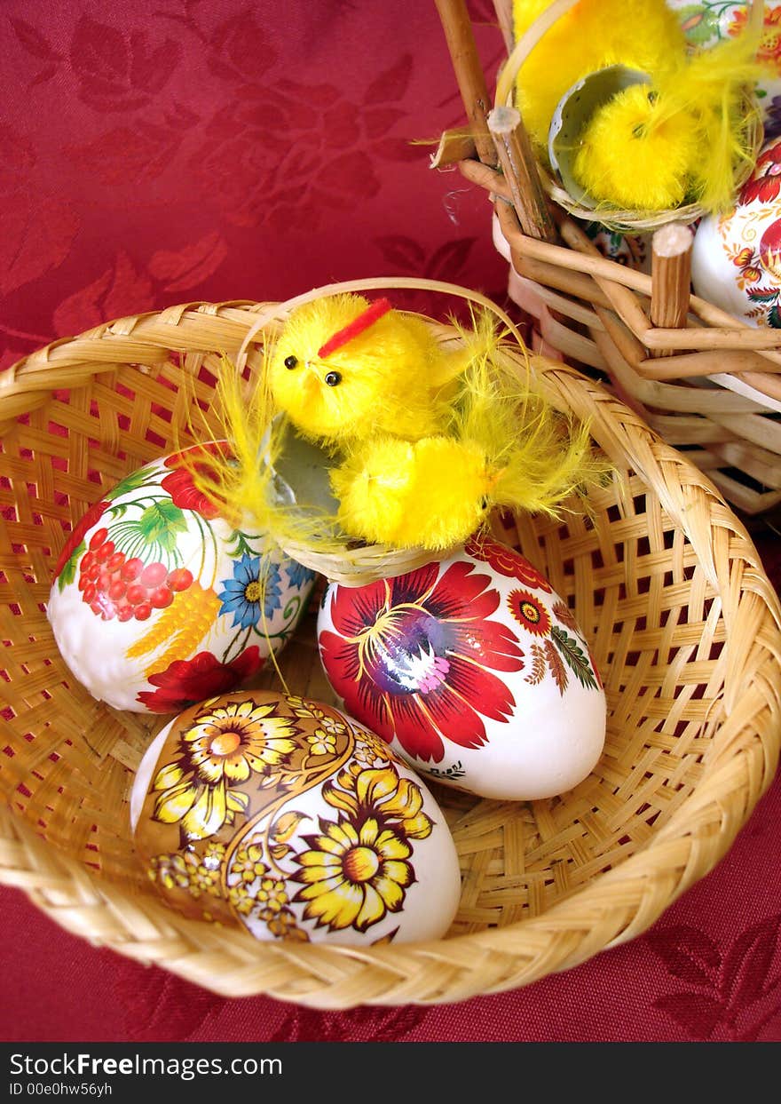 Easter eggs and chicken on basket