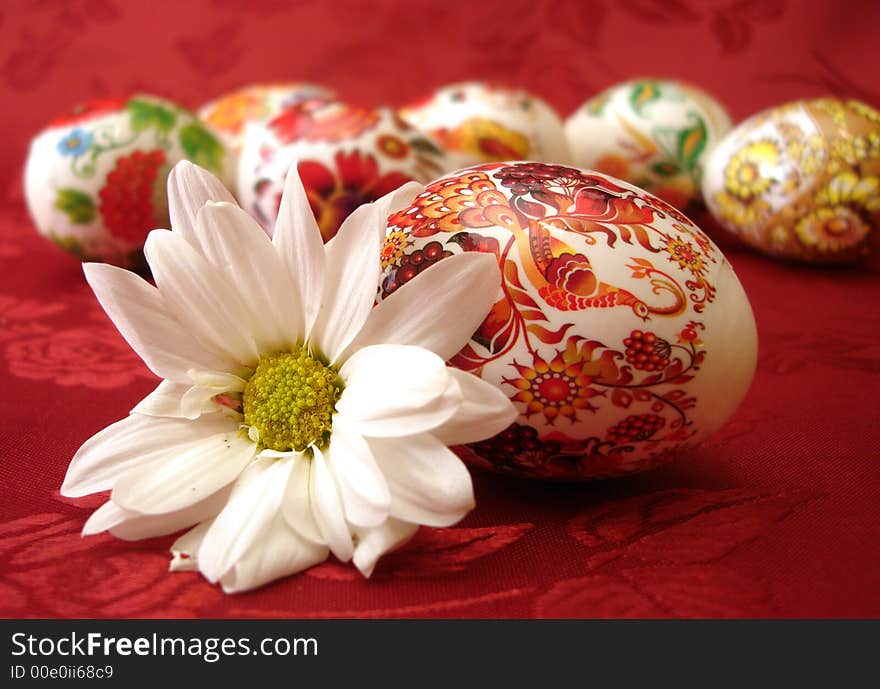 Beautiful red easter eggs and flower