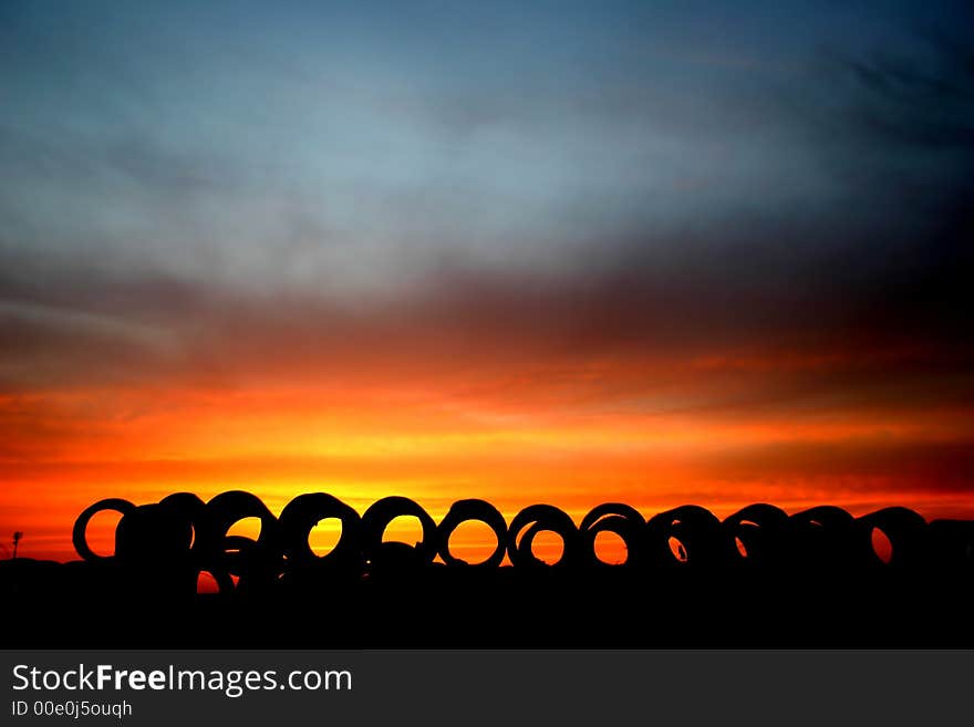 Sun set landscape with big concrete rings