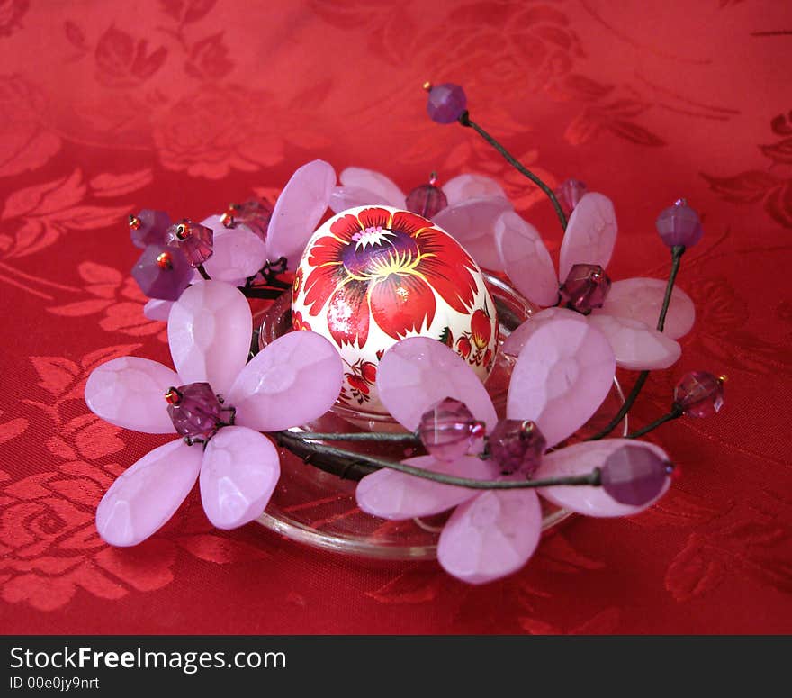 Easter egg with flowers on red background