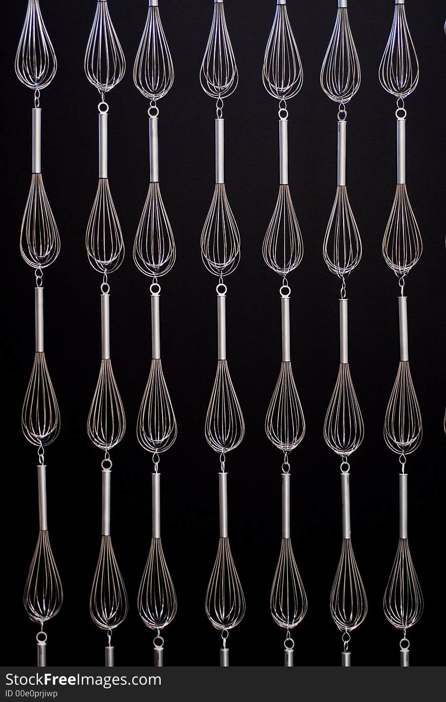 Lots of whisks on black to use as background