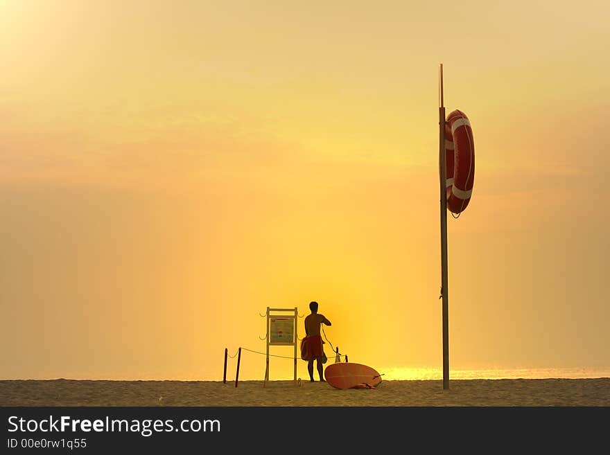 Photo of a lifesaver at sunset