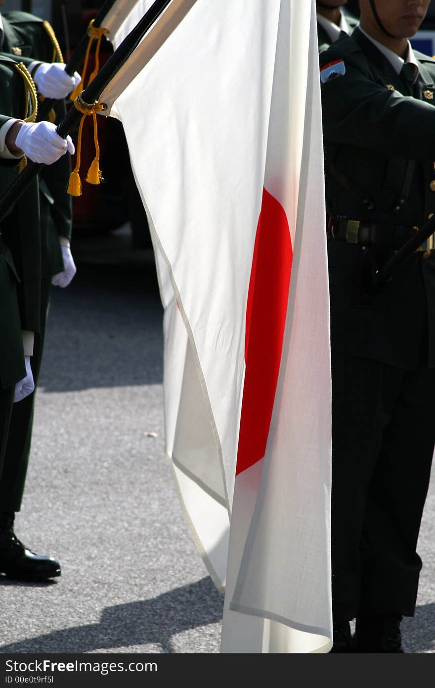 Soldiers holding the Japanese flag