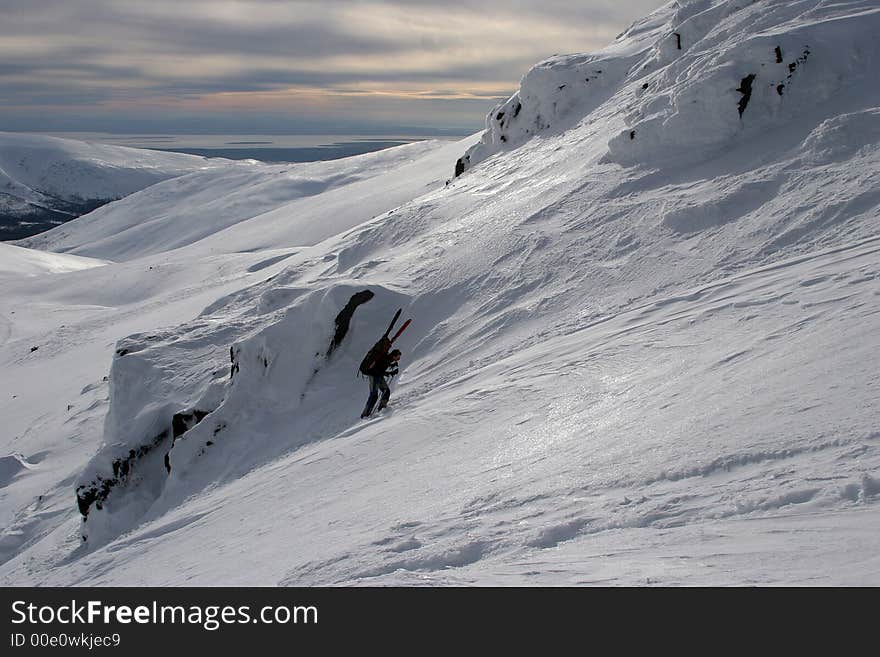 The climber rises on a mountain, North Russia