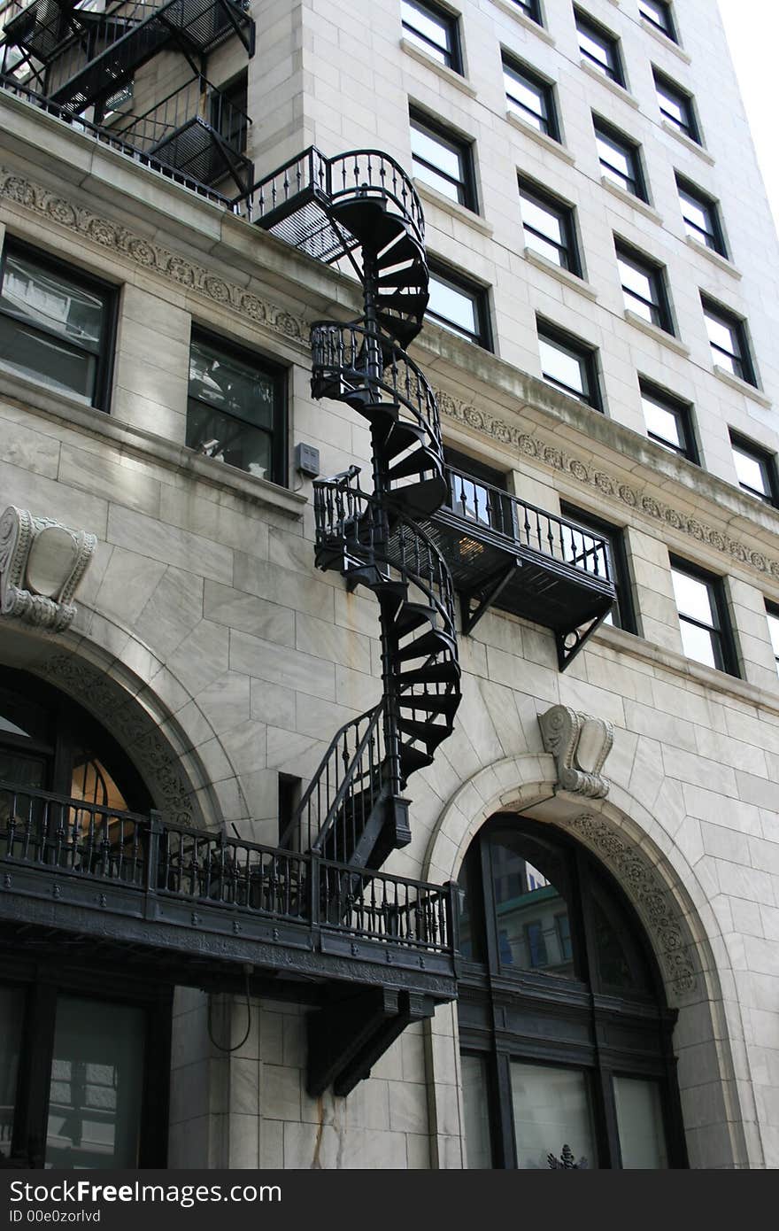 A spirla staircase fire escape on the exterior of a building, Boston.