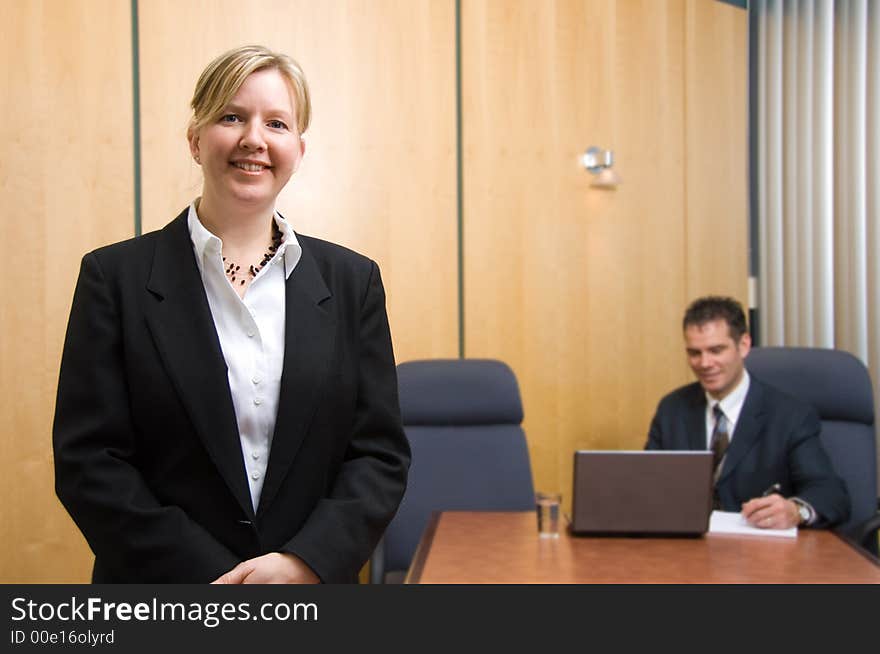 2 business people with woman in foreground. 2 business people with woman in foreground