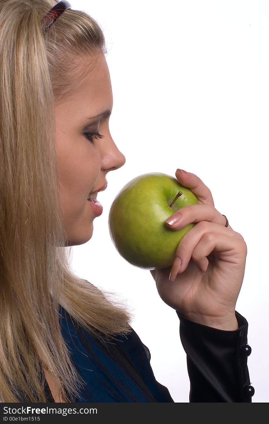 The girl with an apple on a white background