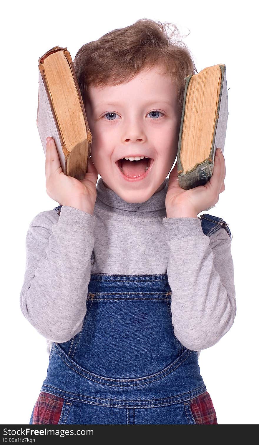 The boy in glasses and with books smiles on a white background. The boy in glasses and with books smiles on a white background