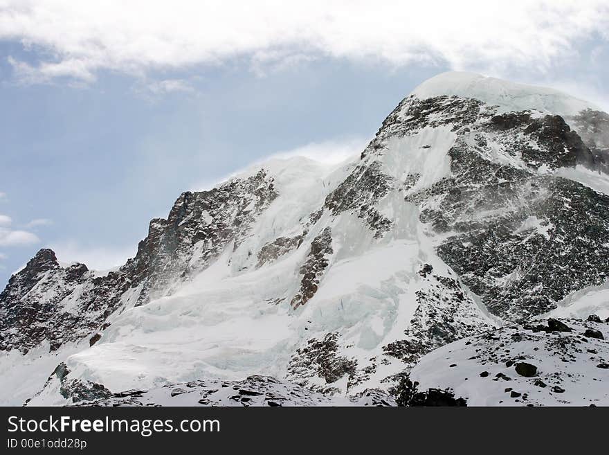 Alpine peak in windy conditions.