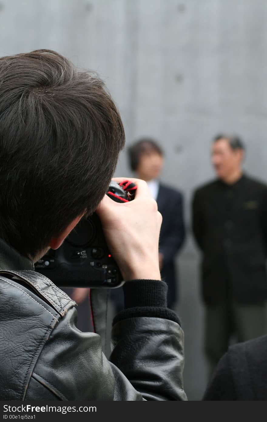 Photographer taking pictures of people