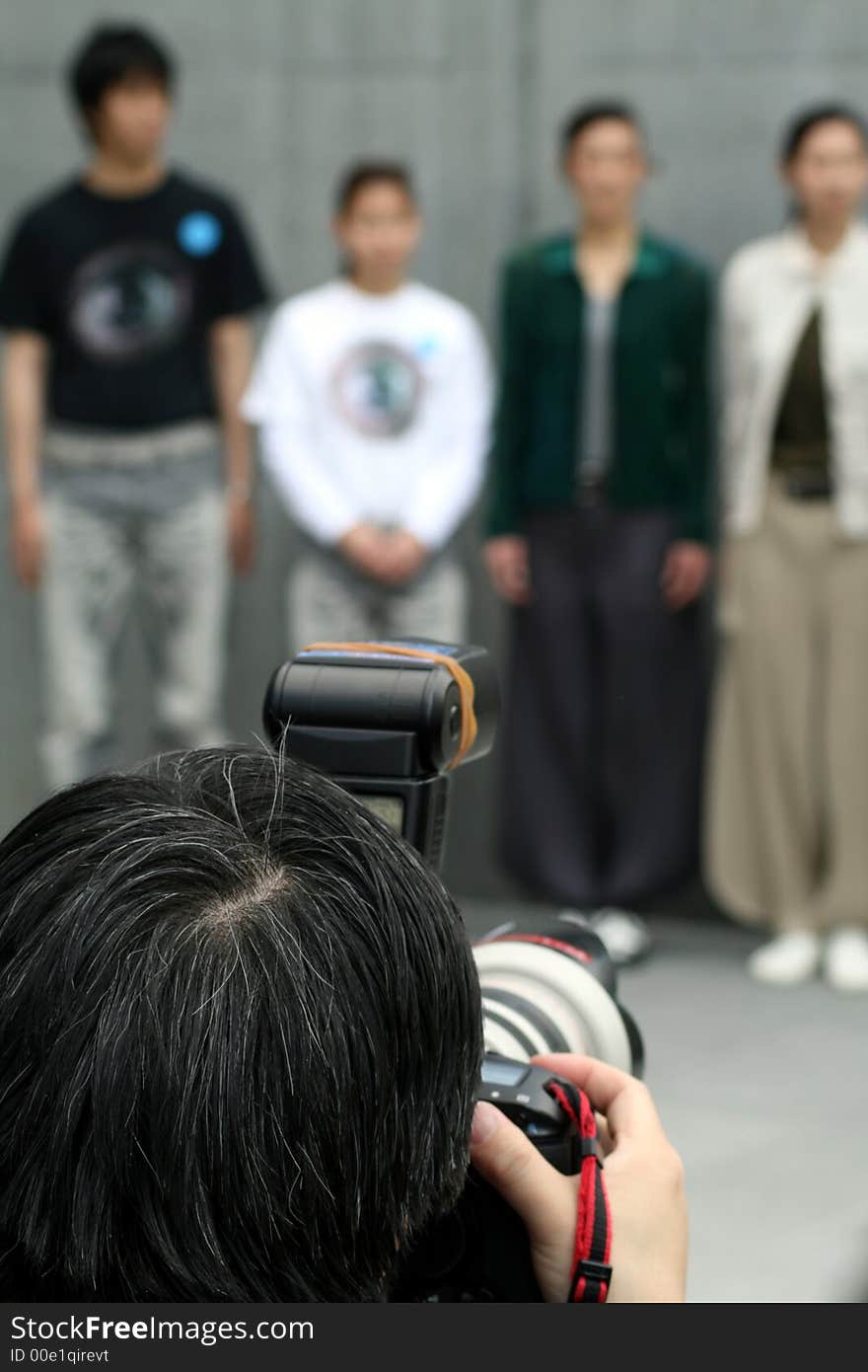 Photographer taking pictures of people