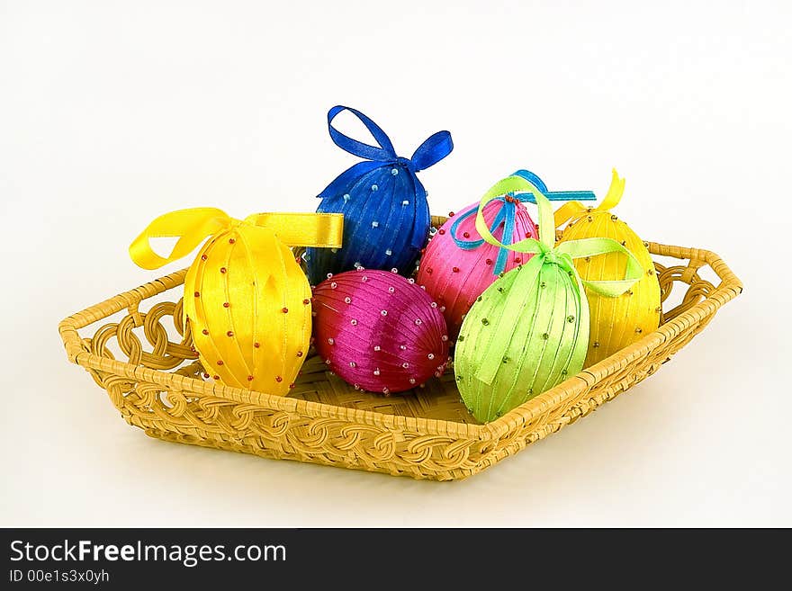 Basket with easter eggs on a light background