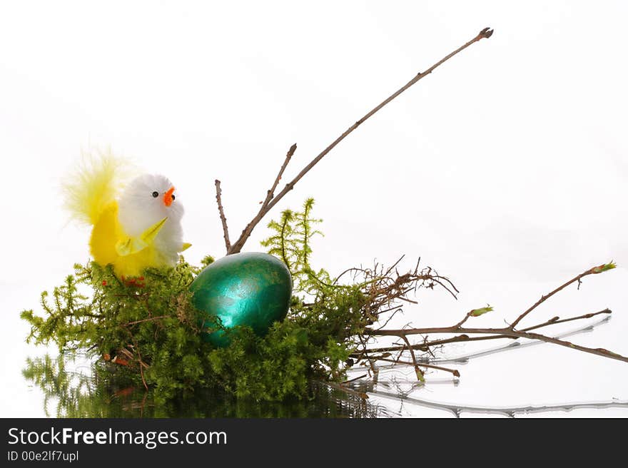 Coloured easter eggs in a jack from a moss and branches. Coloured easter eggs in a jack from a moss and branches