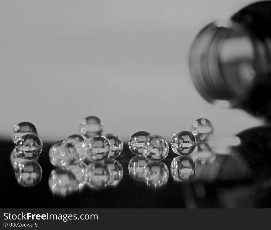 Close up of pills spilling from bottle - black and white. Close up of pills spilling from bottle - black and white