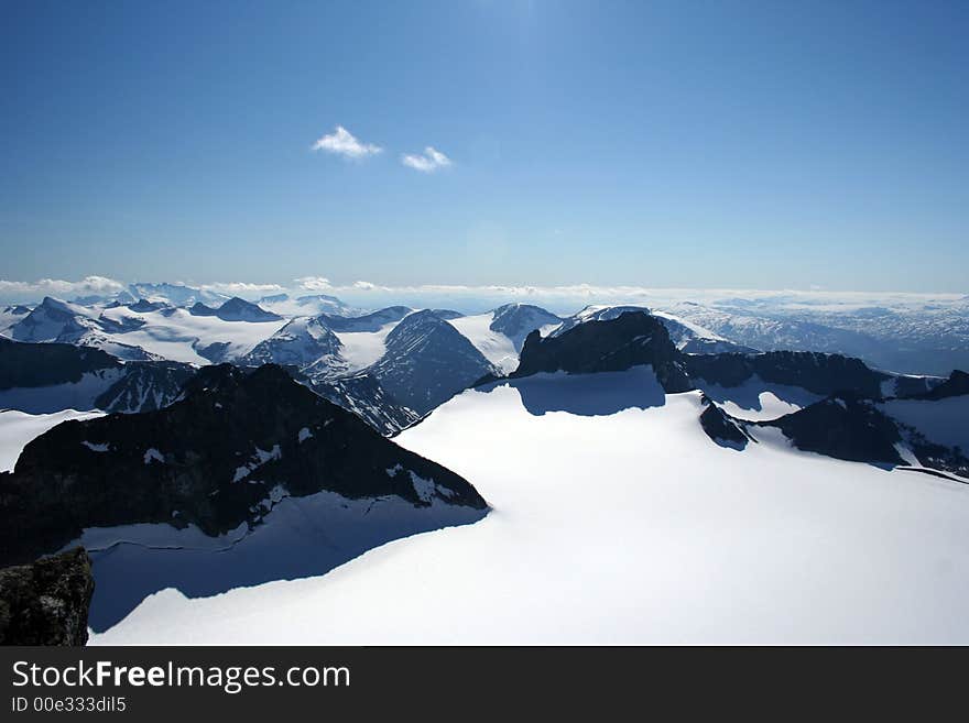 This is an image taken on the top of Galdhoepiggen 2469 meters above sealevel. This is the highest mountain in Northern Europe. The Glacier in the front is called Svellnosbreen. This is an image taken on the top of Galdhoepiggen 2469 meters above sealevel. This is the highest mountain in Northern Europe. The Glacier in the front is called Svellnosbreen.