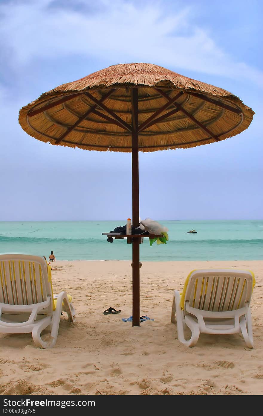 Sunchairs and umbrella on the