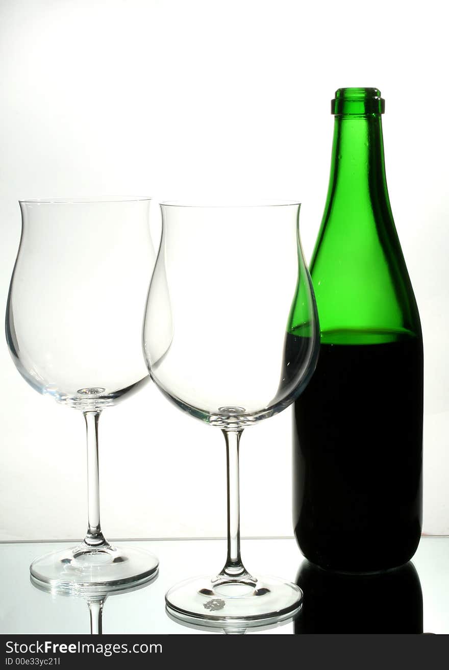 Two wine glasses with red wine close up on grey background