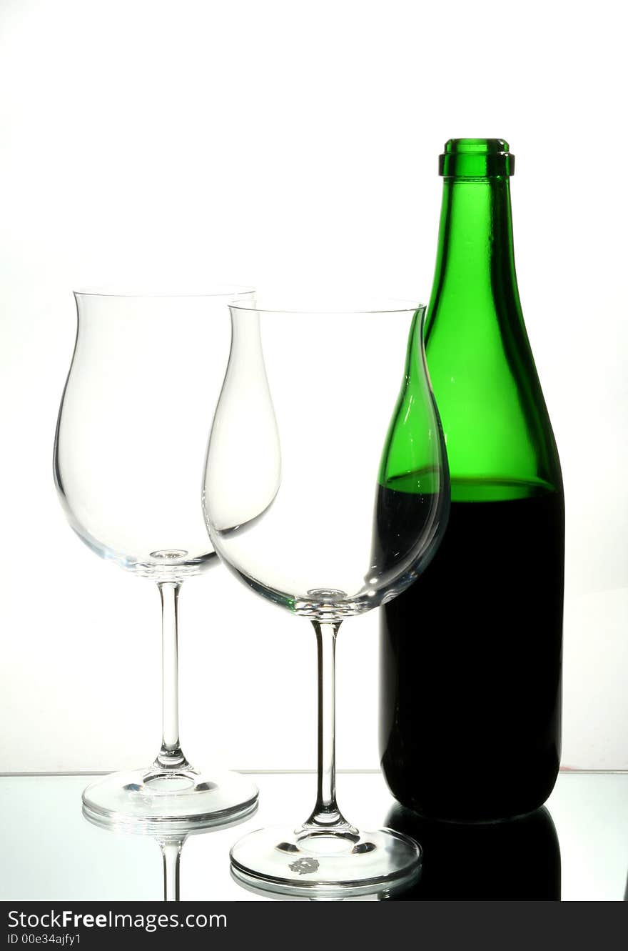 Two wine glasses with red wine close up on grey background