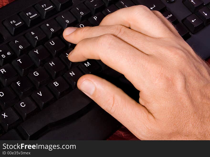 A nice well lit close up of a caucasian hand of a man on a black keybord of a PC. A fresh concept taken from above left. A nice well lit close up of a caucasian hand of a man on a black keybord of a PC. A fresh concept taken from above left.