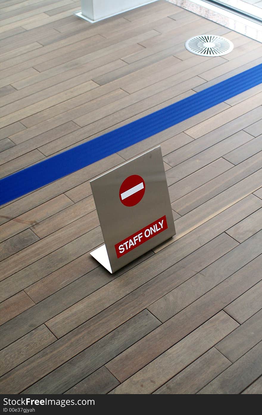 Floor sign saying Staff only