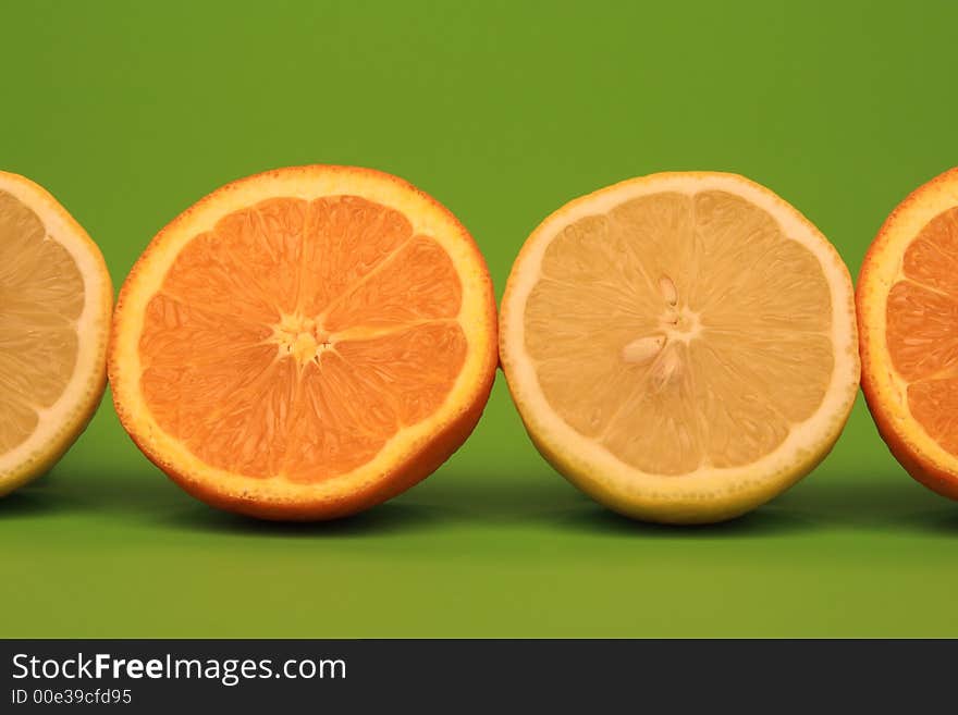 Oranges and Citrons on green background