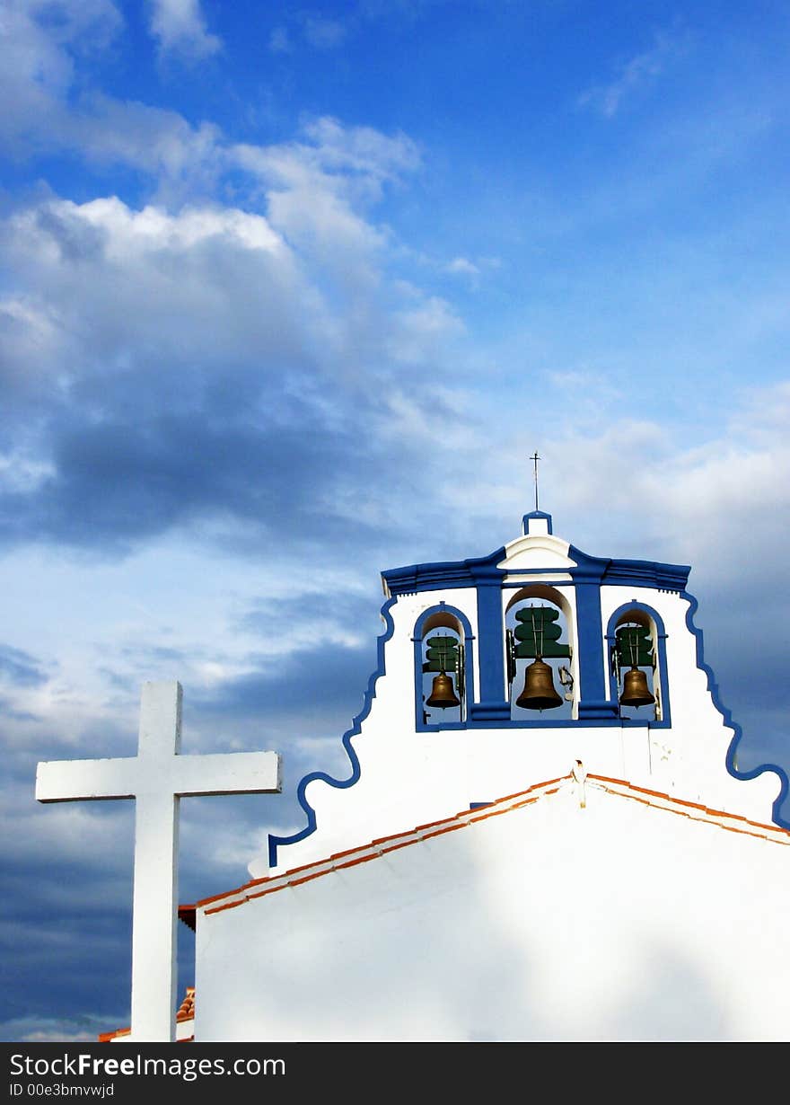 Church And Cross against the Blue Sky