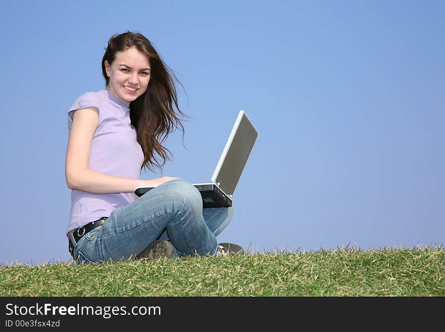 Girl With Notebook On Meadow