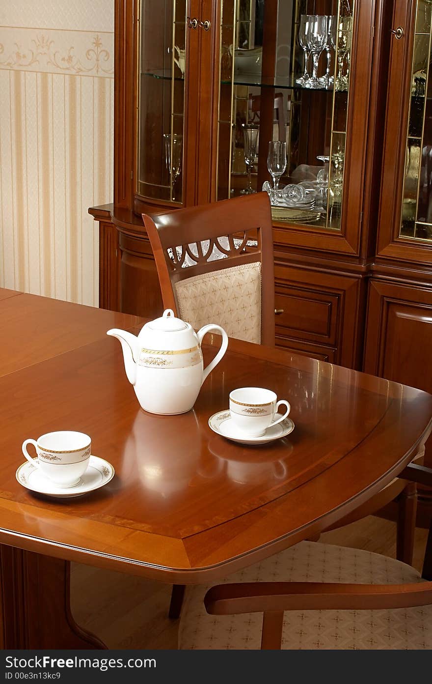 Two cups and teapot on a table