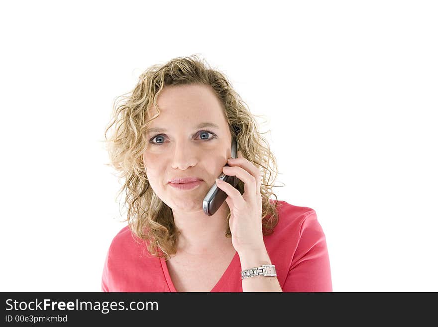 Attractive blonde with a mbile phone isolated on white. Attractive blonde with a mbile phone isolated on white