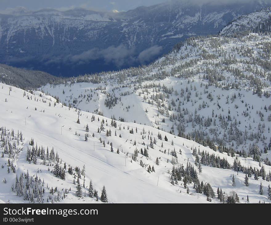 A skii / snowboard hill after a heavy snowfall. A skii / snowboard hill after a heavy snowfall