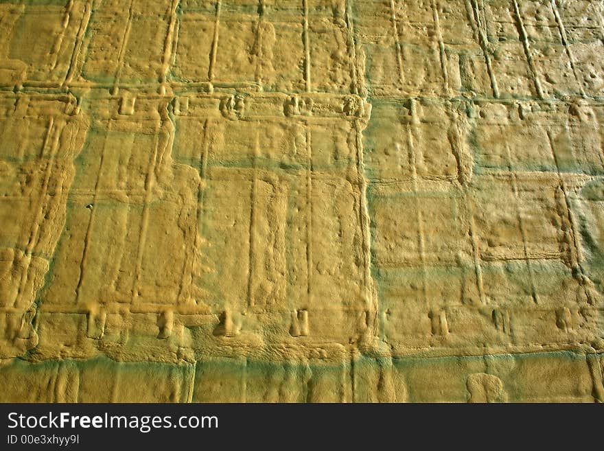 Yellow-green foam texture (foam covering the wall of a building under construction).