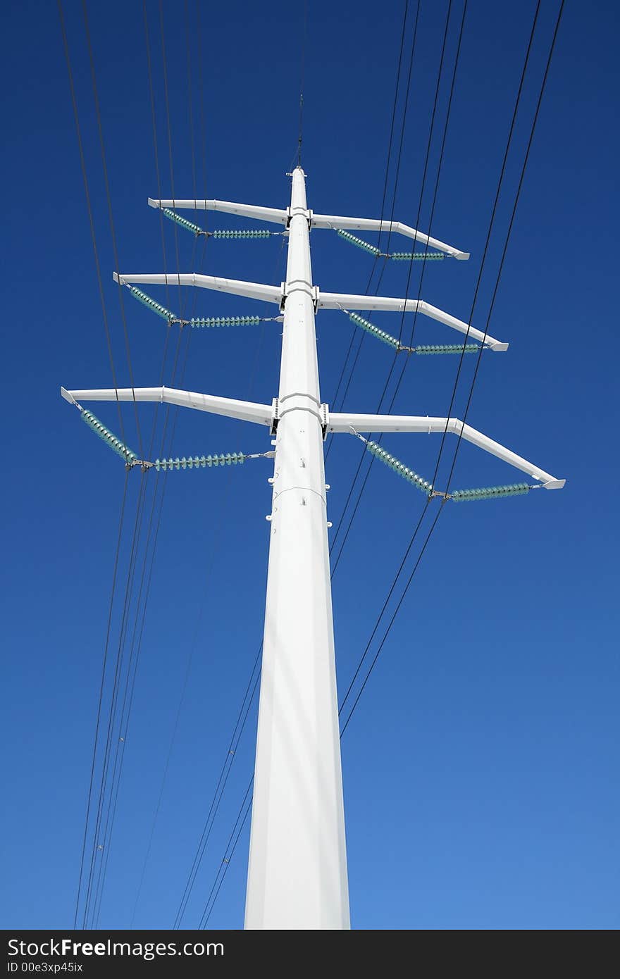 White high voltage electricity tower and power lines. White high voltage electricity tower and power lines.