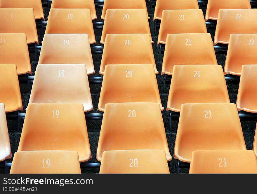 Many Empty Seats In Rows In An Outdoor Stadium. Many Empty Seats In Rows In An Outdoor Stadium