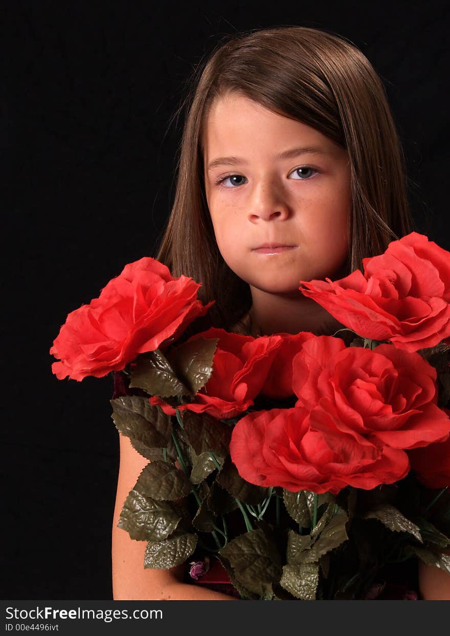 Brunette beauty with red flowers. Brunette beauty with red flowers