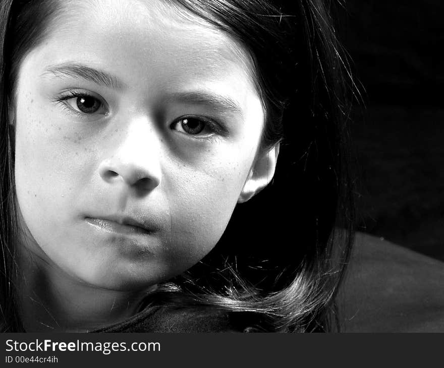 Head shot of an adorable brunette girl. Head shot of an adorable brunette girl