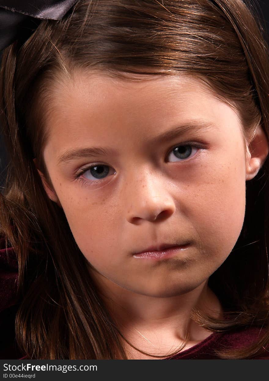 Head shot of an adorable brunette girl. Head shot of an adorable brunette girl