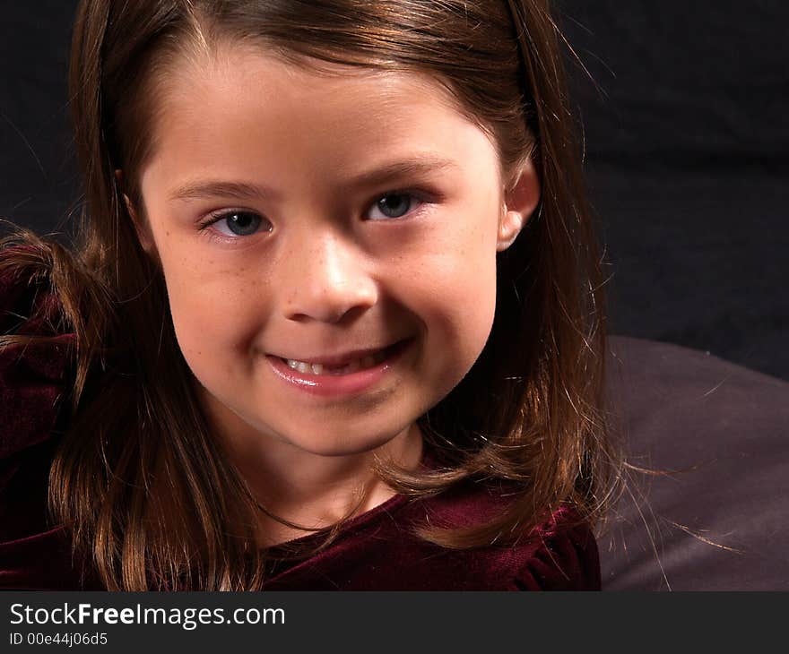 Head shot of an adorable brunette girl. Head shot of an adorable brunette girl