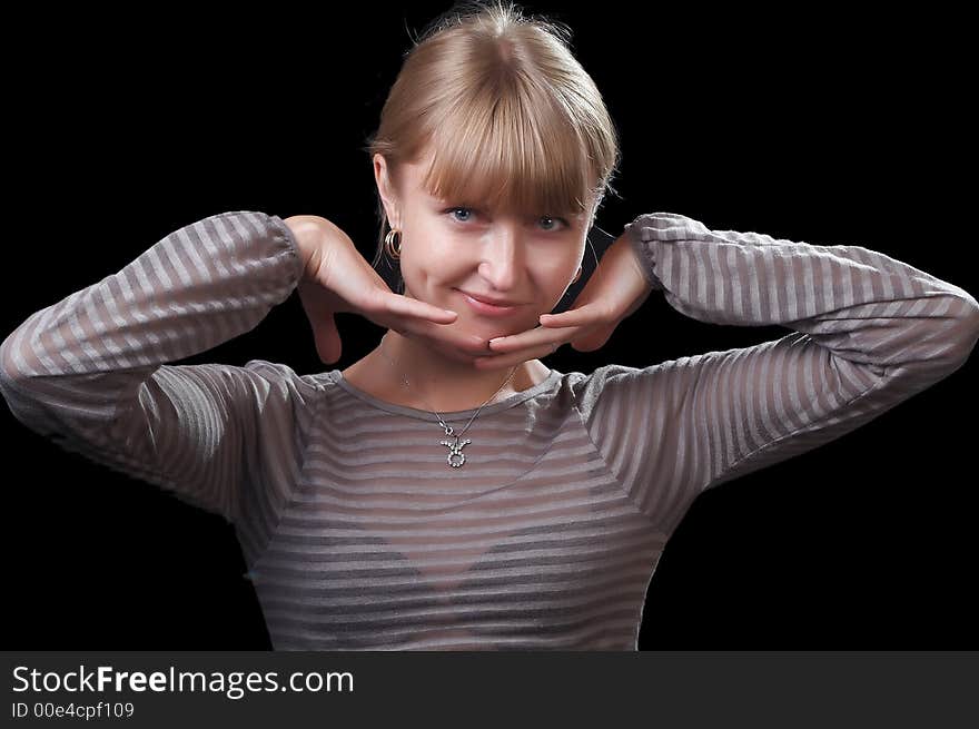 Portrait of the beautiful woman on a black background. Portrait of the beautiful woman on a black background