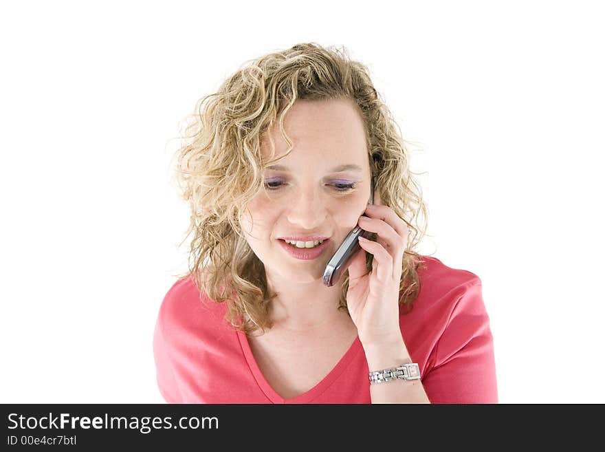 Attractive blonde with a mbile phone isolated on white. Attractive blonde with a mbile phone isolated on white